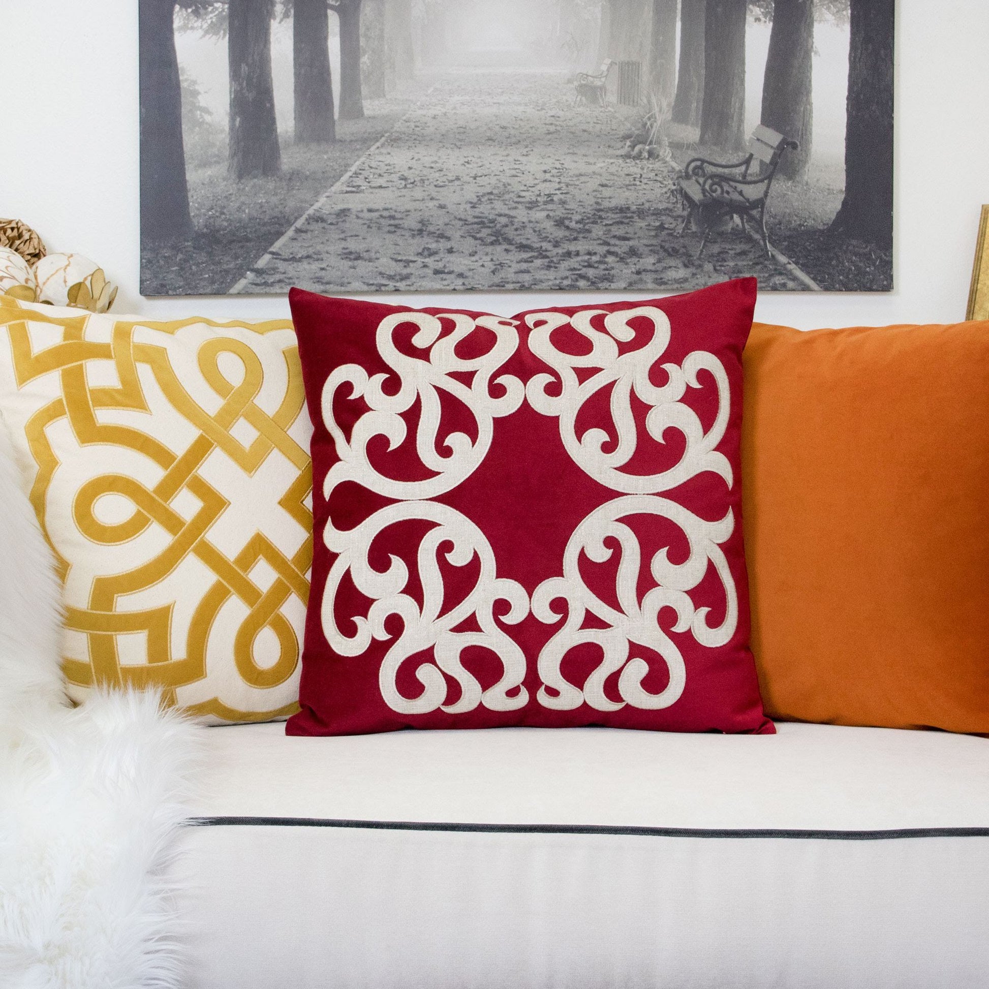 Dora pillow cover with matching back, red with white scroll pattern on sofa with three cushions on Tampa Home & Garden Store