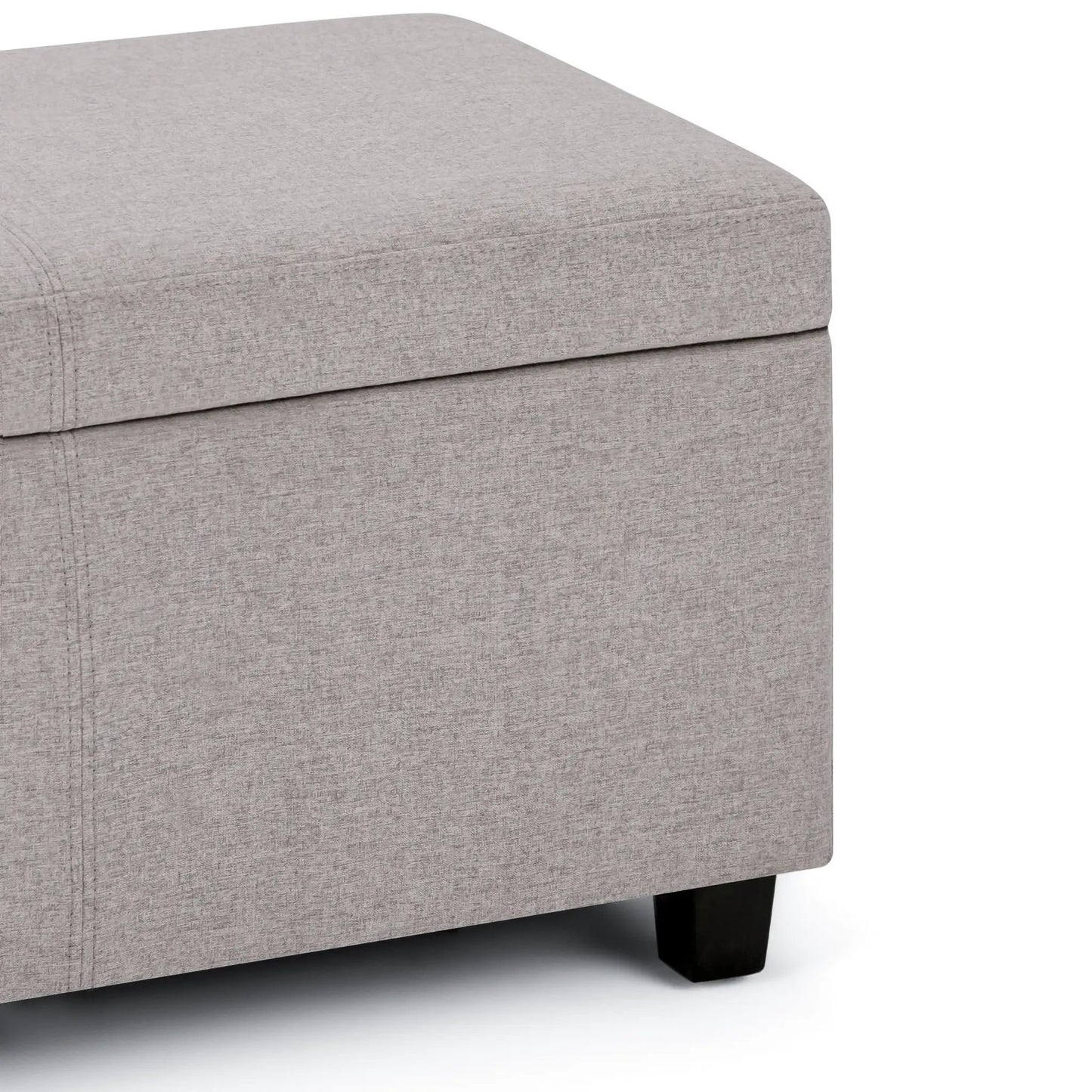 Avalon storage ottoman bench in light gray textured fabric with black wooden legs on Tampa Home & Garden Store