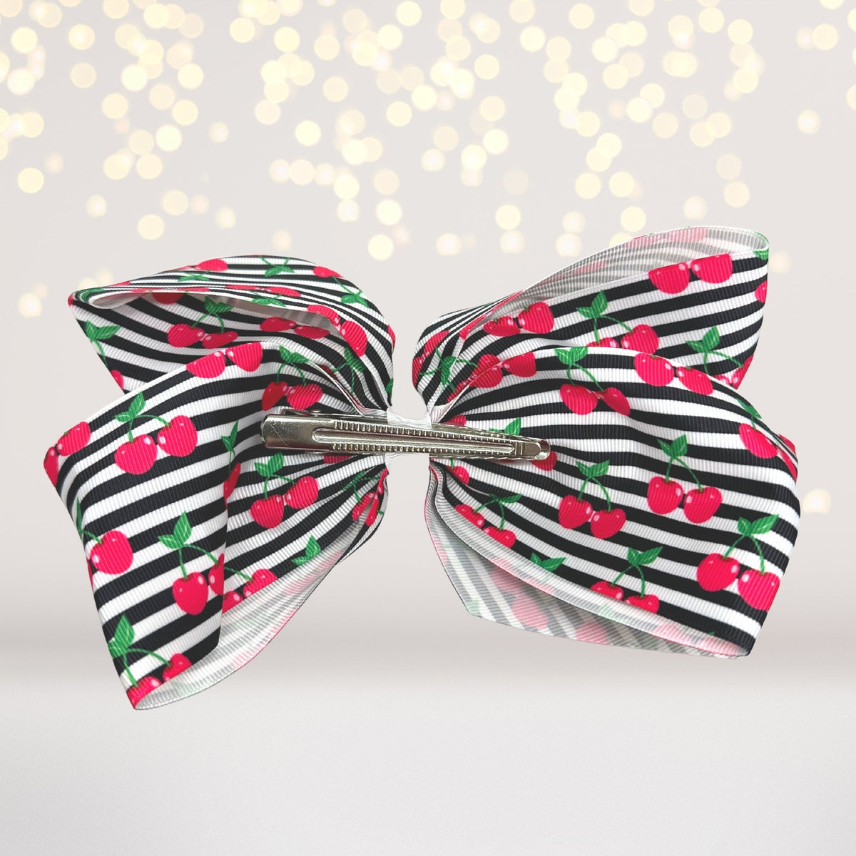 Fun Fruit Hair Bows set; two 8 inch cherry-print bows with striped pattern and metal clips on Tampa Home & Garden Store
