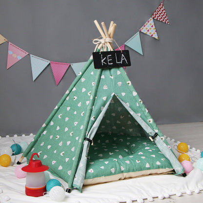 Pet tent kennel teal fabric tepee with white triangle pattern and wooden poles on Tampa Home & Garden Store