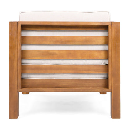 Outdoor club chair with beige cushions and solid wood frame on Tampa Home & Garden Store