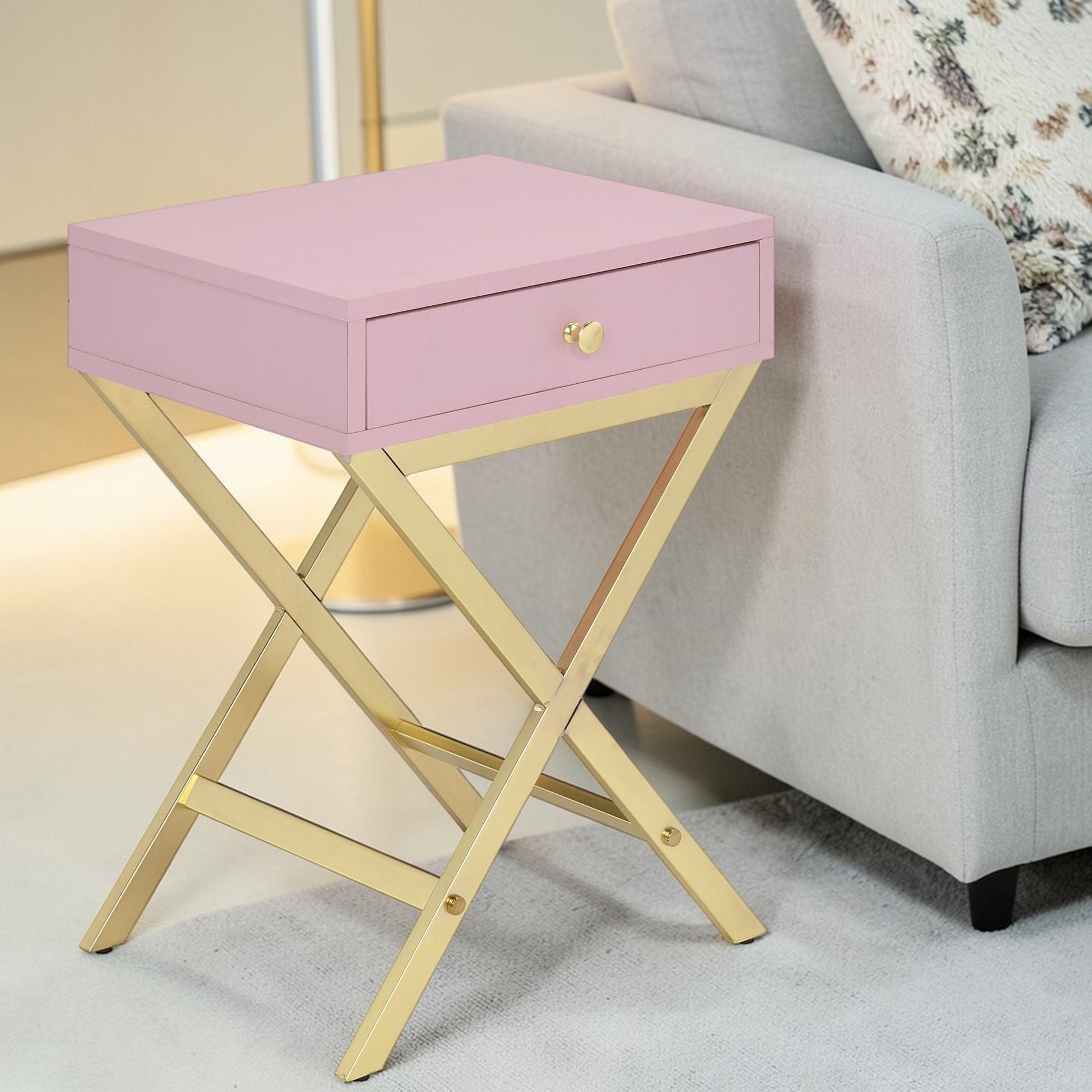 Coleen pink accent table with gold X-frame base and single drawer with brass knob on Tampa Home & Garden Store