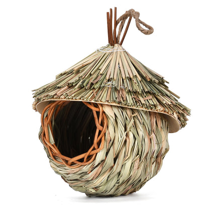 Hanging straw bird nest in natural beige and green tones with woven base and rope loop on Tampa Home & Garden Store