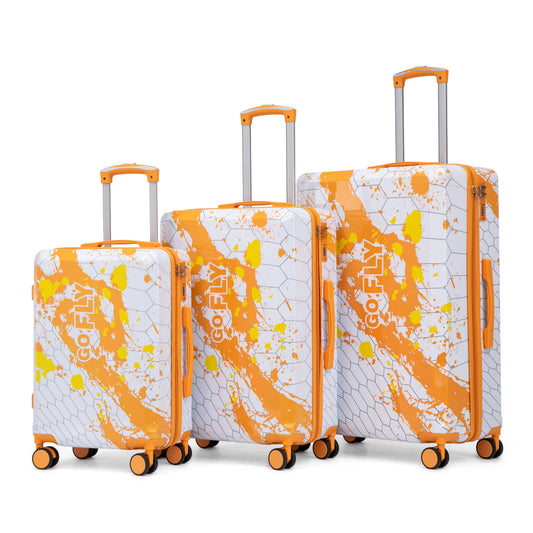 3-piece PC spinner luggage set in orange and white splatter with orange trim and spinner wheels on Tampa Home & Garden Store