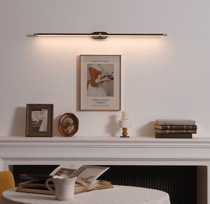 Rechargeable linear LED wall lamp with remote; brass bar, black mount above mantel on Tampa Home & Garden Store