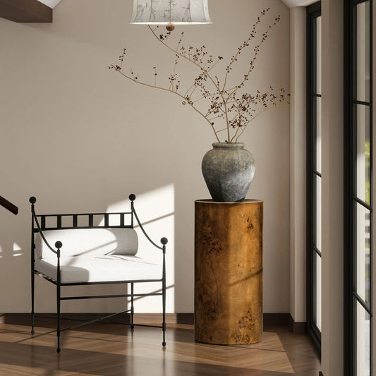 Nebula Accent Pillar Side Table with burlwood pedestal and ceramic vase with dried branches on Tampa Home & Garden Store