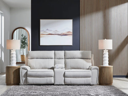 Social Pointe reclining sectional in light gray fabric with two round wooden end tables on Tampa Home & Garden Store