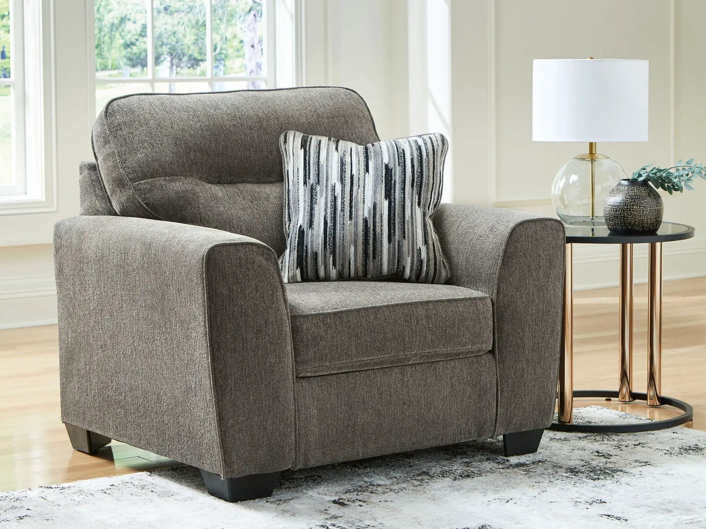 Olten 2-piece stationary chair and ottoman in gray textured fabric with striped pillow on Tampa Home & Garden Store
