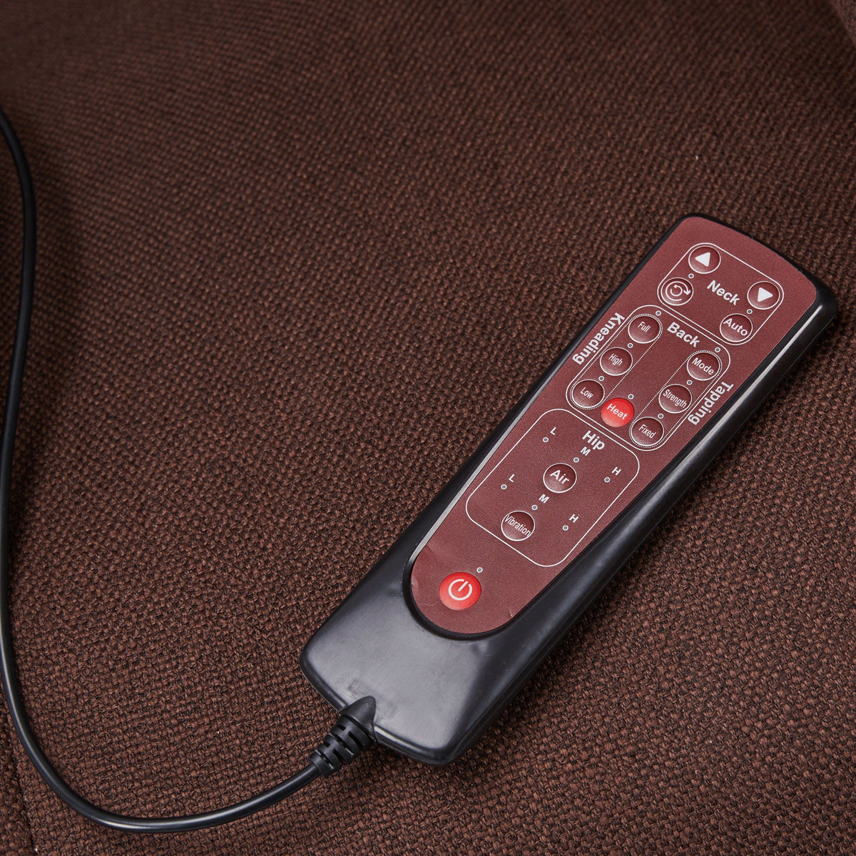 Massage chair remote control with red panel and labeled Neck, Back buttons on brown fabric on Tampa Home & Garden Store