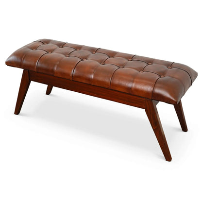Maja bench in cognac leather with button tufting and dark brown wooden legs on Tampa Home & Garden Store