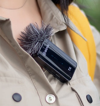 BOYA clip-on microphone with furry windscreen clipped to beige shirt for mobile/SLR use on Tampa Home & Garden Store