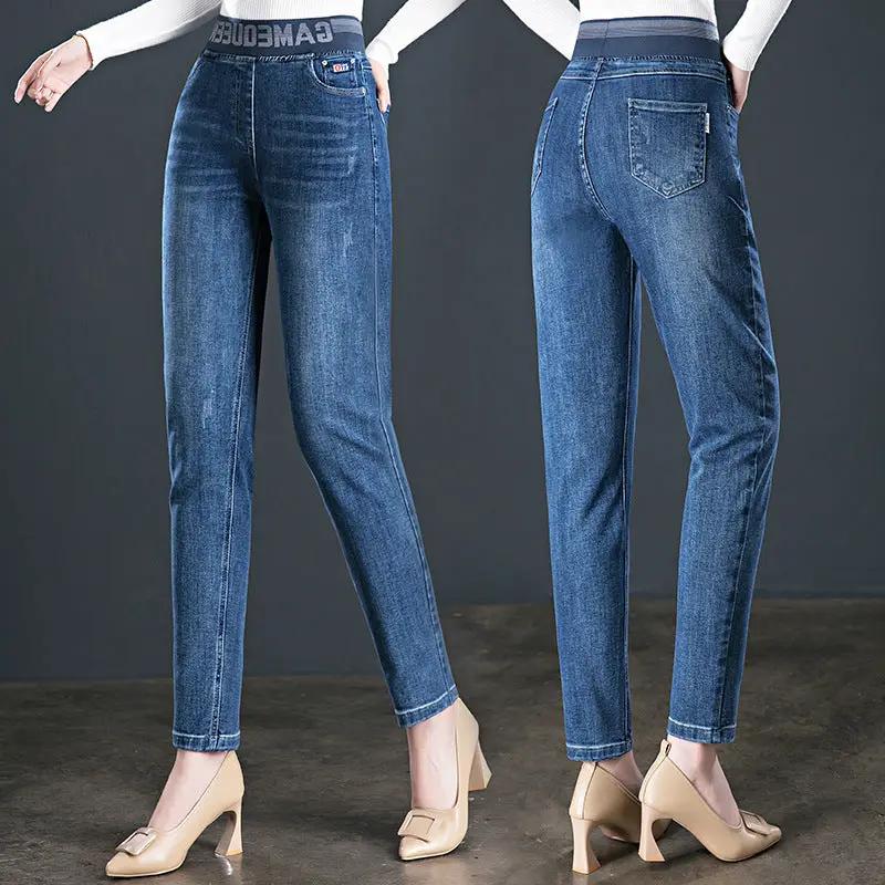 Women's fleece-lined high-waist slim jeans in blue denim, elastic waistband, front/back on Tampa Home & Garden Store