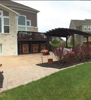 Outdoor Privacy Screen by Rustica Ornamentals, extra large 46-inch dark wood panels along a deck on Tampa Home & Garden Store