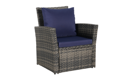 Outdoor rattan chair with navy cushions on Tampa Home & Garden Store
