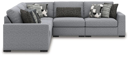 Bealton sectional sofa in gray textured fabric with assorted patterned cushions left chaise on Tampa Home & Garden Store