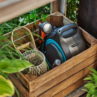 MoveMatic 18690 portable hose box by Gardena with blue hose reel inside a wooden planter on Tampa Home & Garden Store