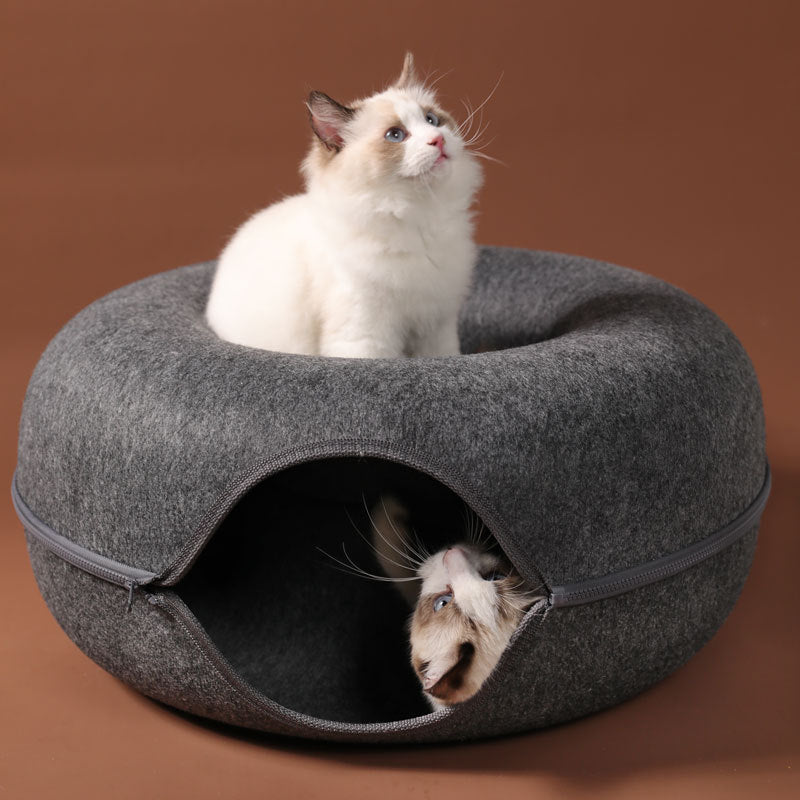 Round grey wool felt cat nest tunnel with two cats, one inside and one perched on top on Tampa Home & Garden Store