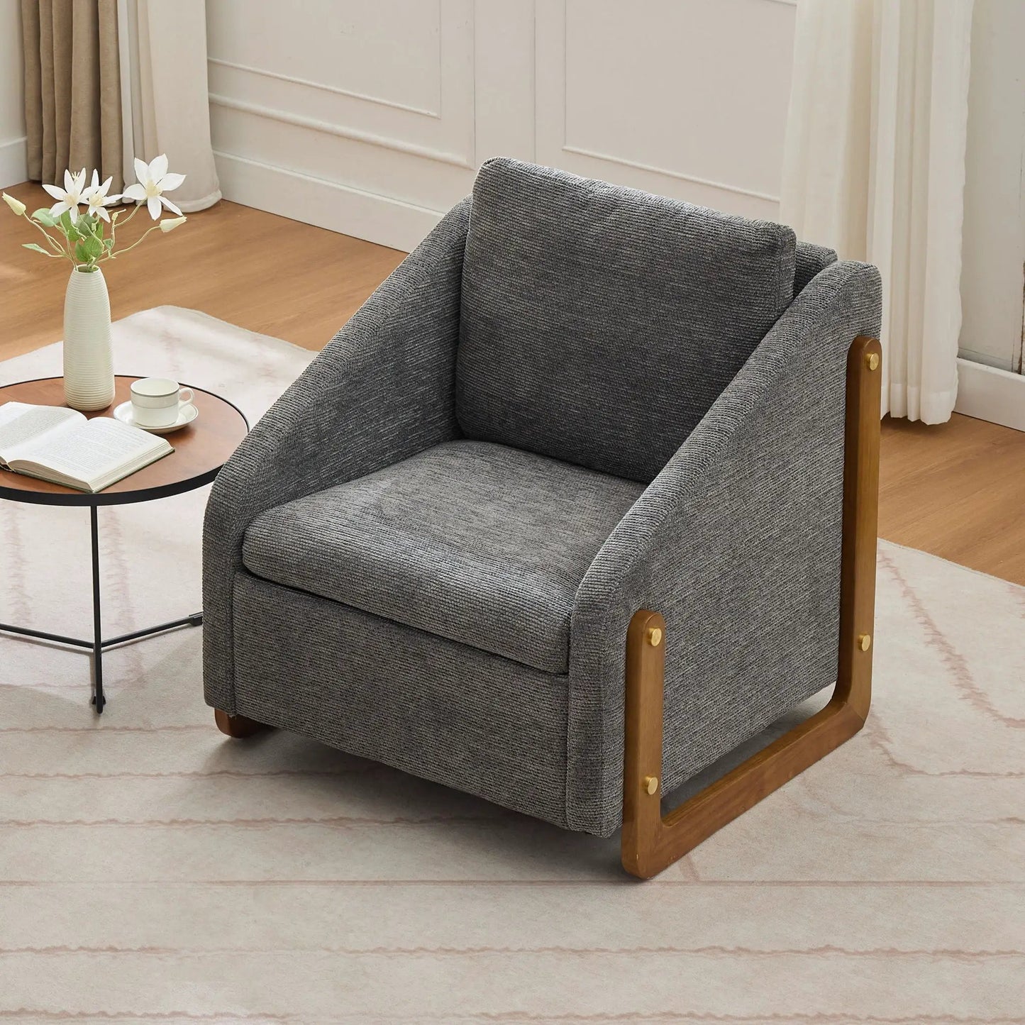 Modern upholstered armchair in dark gray textured fabric with light wood side frame on Tampa Home & Garden Store