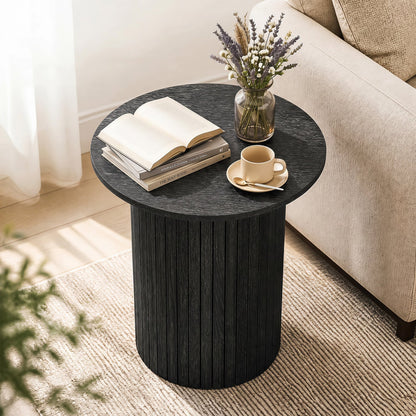 18-inch round fluted side table with pedestal drum base in black wood grain; books, vase, teacup on Tampa Home & Garden Store