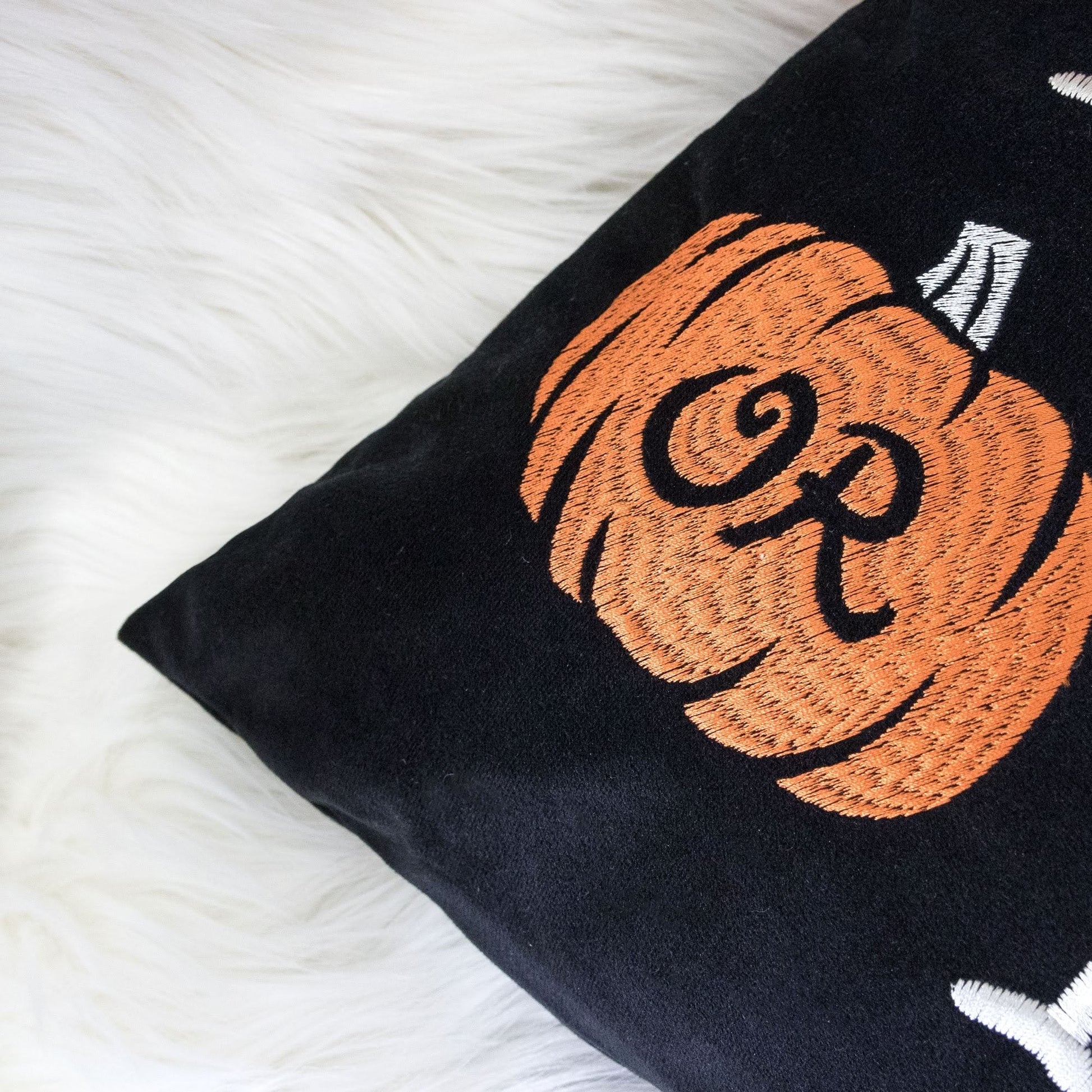 Halloween lumbar pillow embroidered Trick or Treat on black cushion with pumpkin design on Tampa Home & Garden Store