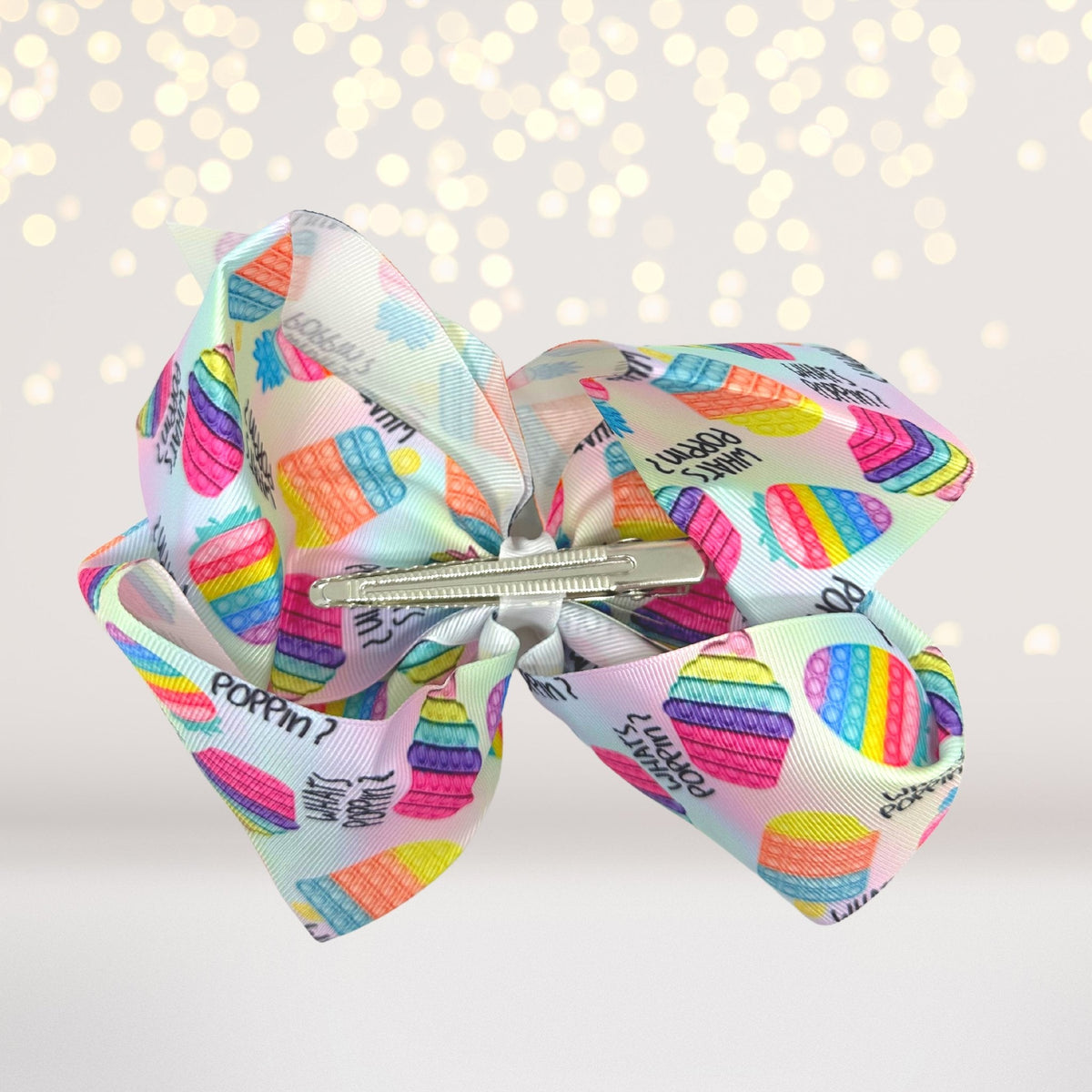 Rainbow Pop Toy Hair Bow & Oversized Sensory Barrette with rainbow grosgrain and metal clip on Tampa Home & Garden Store