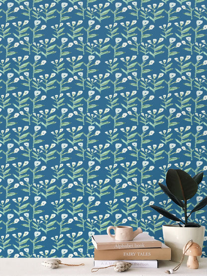 Sydney Wallpaper (Marine) repeat pattern; teal background with green stems and white blossoms on Tampa Home & Garden Store