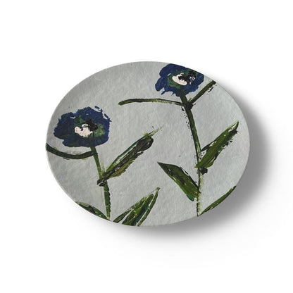 China plate featuring blue and teal posey flowers with green stems on a light background on Tampa Home & Garden Store