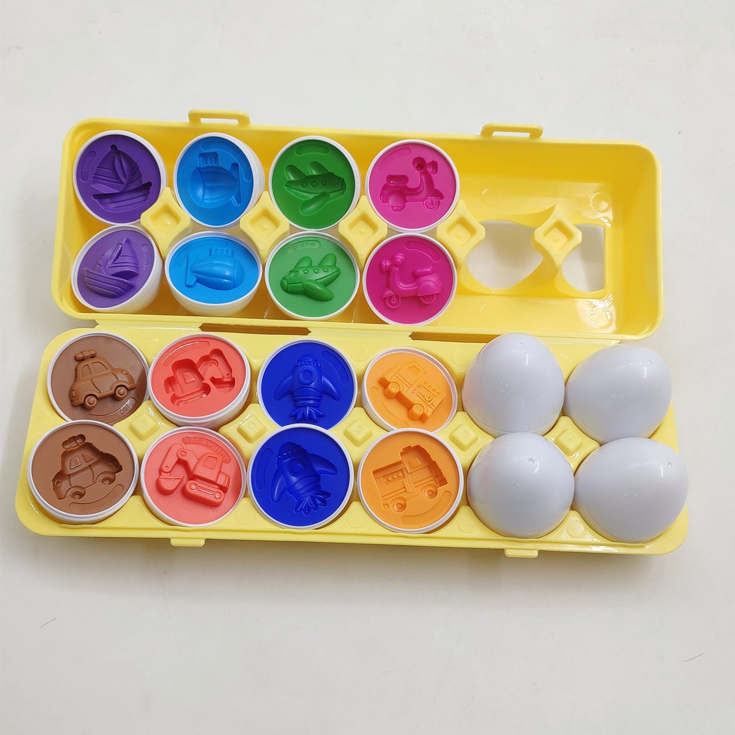 Smart egg shape sorter toy set in a yellow case with 8 colorful vehicle lids on Tampa Home & Garden Store