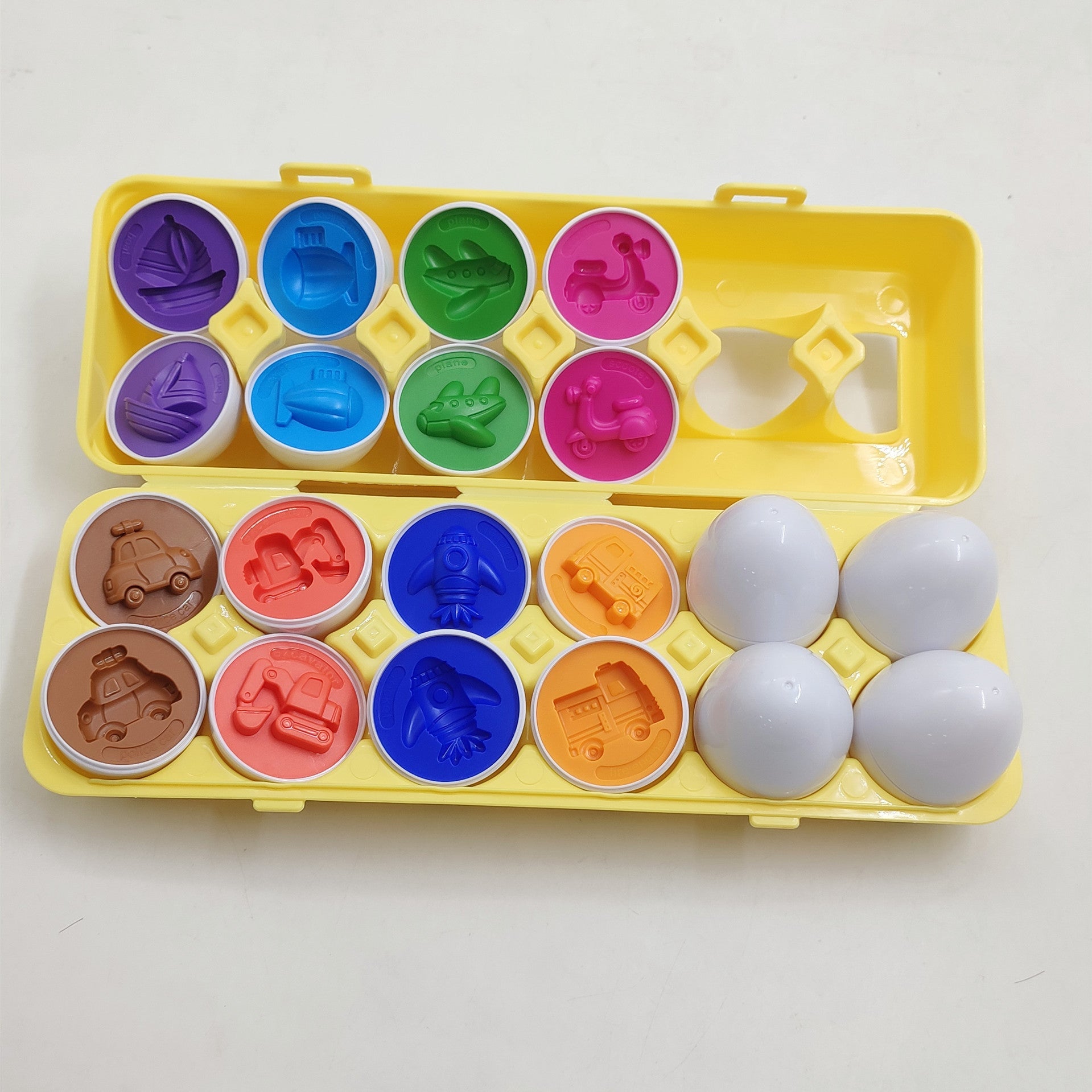 Smart egg shape sorter toy set in a yellow case with 8 colorful vehicle lids on Tampa Home & Garden Store