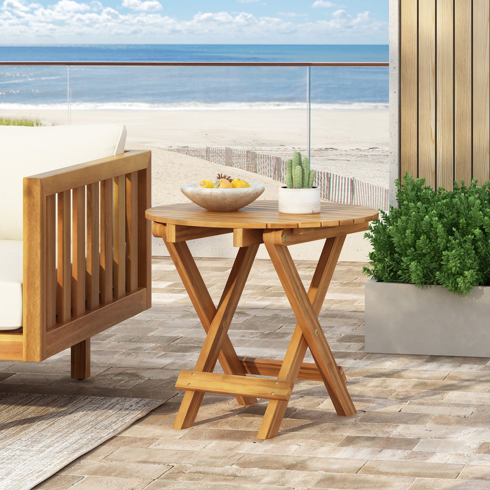 Patio conversation set with foldable acacia wood side table and cushioned chairs on Tampa Home & Garden Store