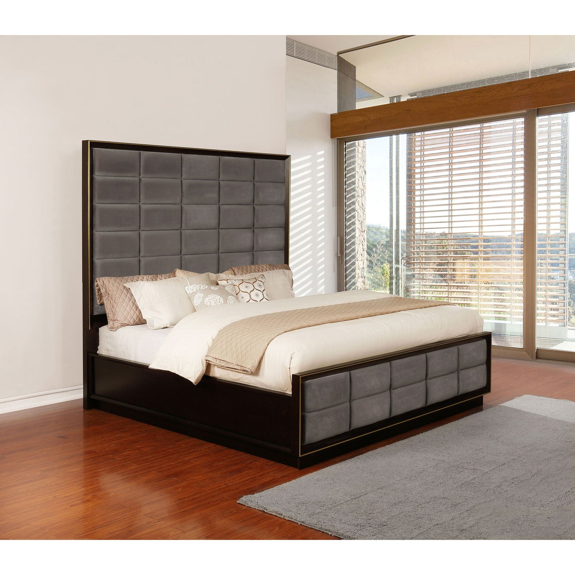 Drea Panel Bed featuring dark wood frame with gold trim and tufted gray headboard on Tampa Home & Garden Store