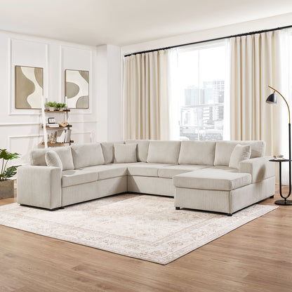 Oversized U-shaped sectional sofa with chaise in beige striped fabric and three soft throw pillows in a bright living room on Tampa Home & Garden Store
