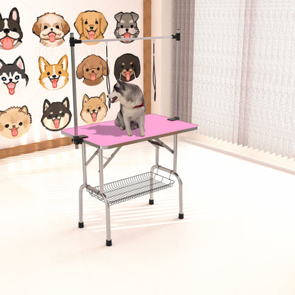 Foldable pet grooming table with pink mat, stainless steel frame and adjustable arm clamps on Tampa Home & Garden Store