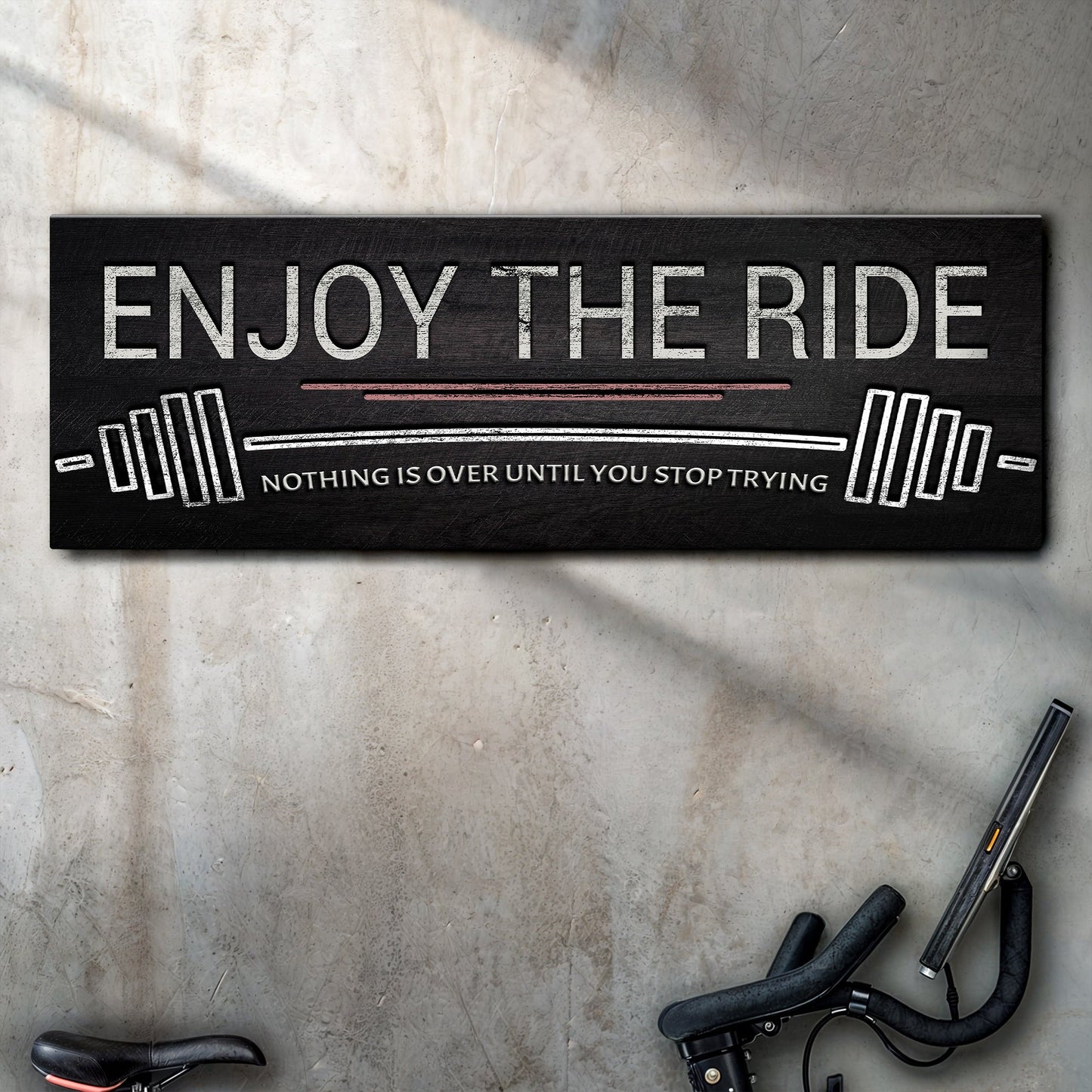 Enjoy The Ride gym sign canvas by Tailored Canvases; black textured surface with white distressed lettering on Tampa Home & Garden Store