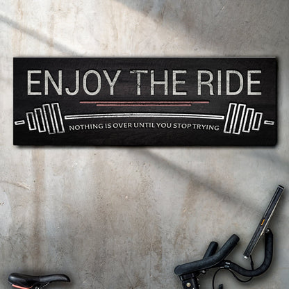 Enjoy The Ride gym sign canvas by Tailored Canvases; black textured surface with white distressed lettering on Tampa Home & Garden Store
