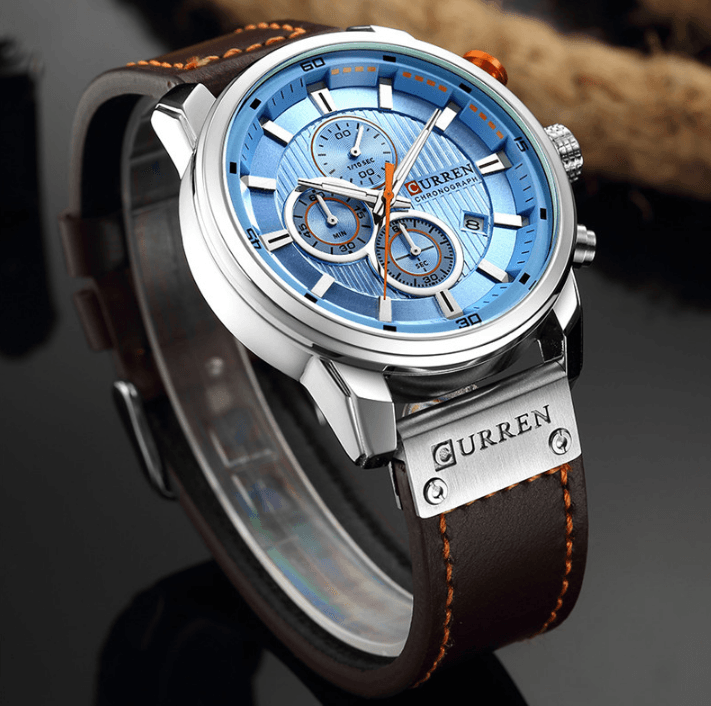 Men's blue chronograph watch with brown leather strap and Curren branding, Hardlex glass on Tampa Home & Garden Store