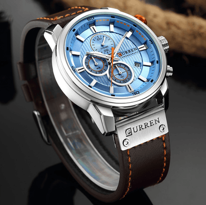 Men's blue chronograph watch with brown leather strap and Curren branding, Hardlex glass on Tampa Home & Garden Store