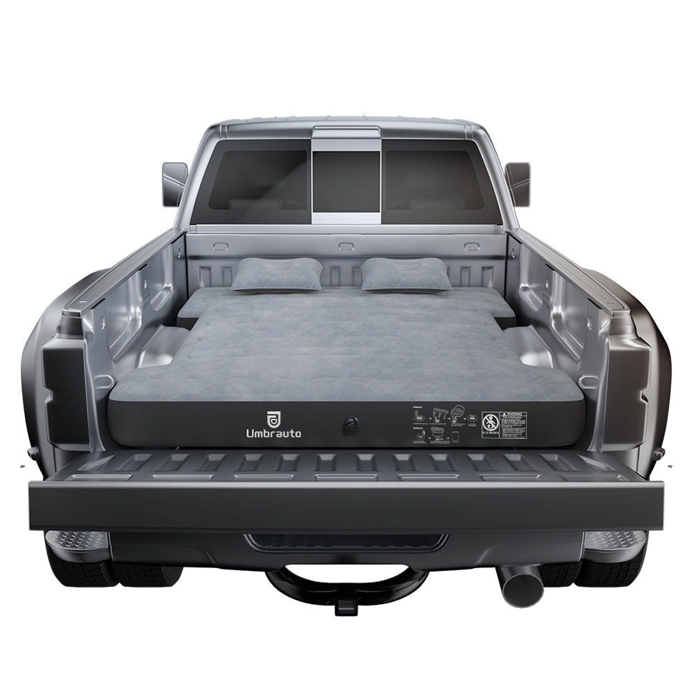 6ft Isuzu Truck Bed Air Mattress Umbrauto, gray inflatable bed with two pillows in a pickup bed on Tampa Home & Garden Store