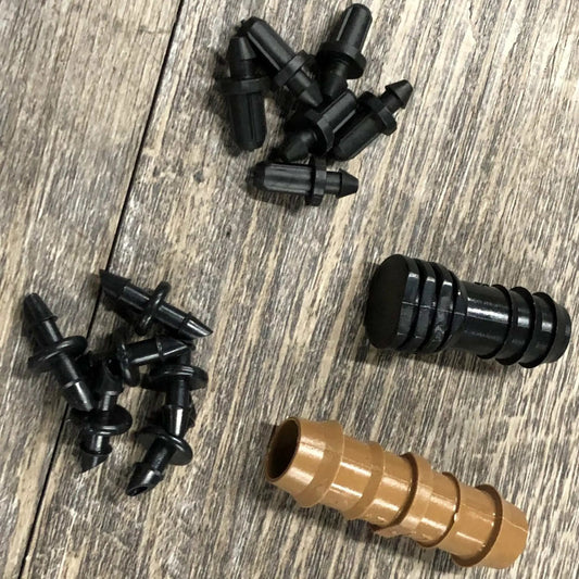Varden Irrigation Parts Package with black fittings and brown barbed connectors on wood on Tampa Home & Garden Store