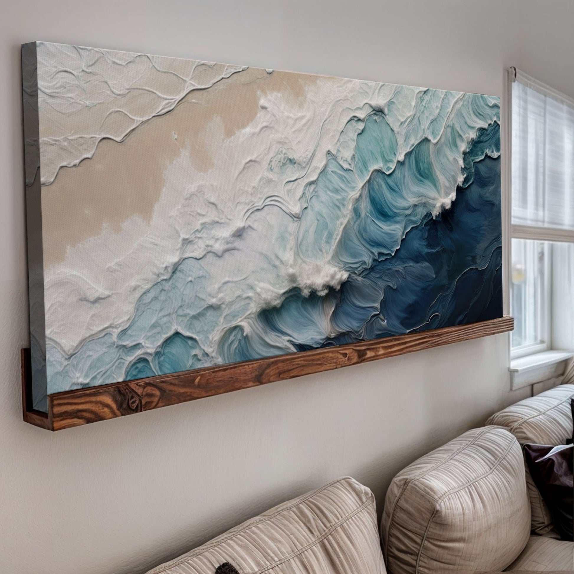 Crashing Coastal Waves canvas wall art in beige teal tones, mounted on wall above wood shelf on Tampa Home & Garden Store