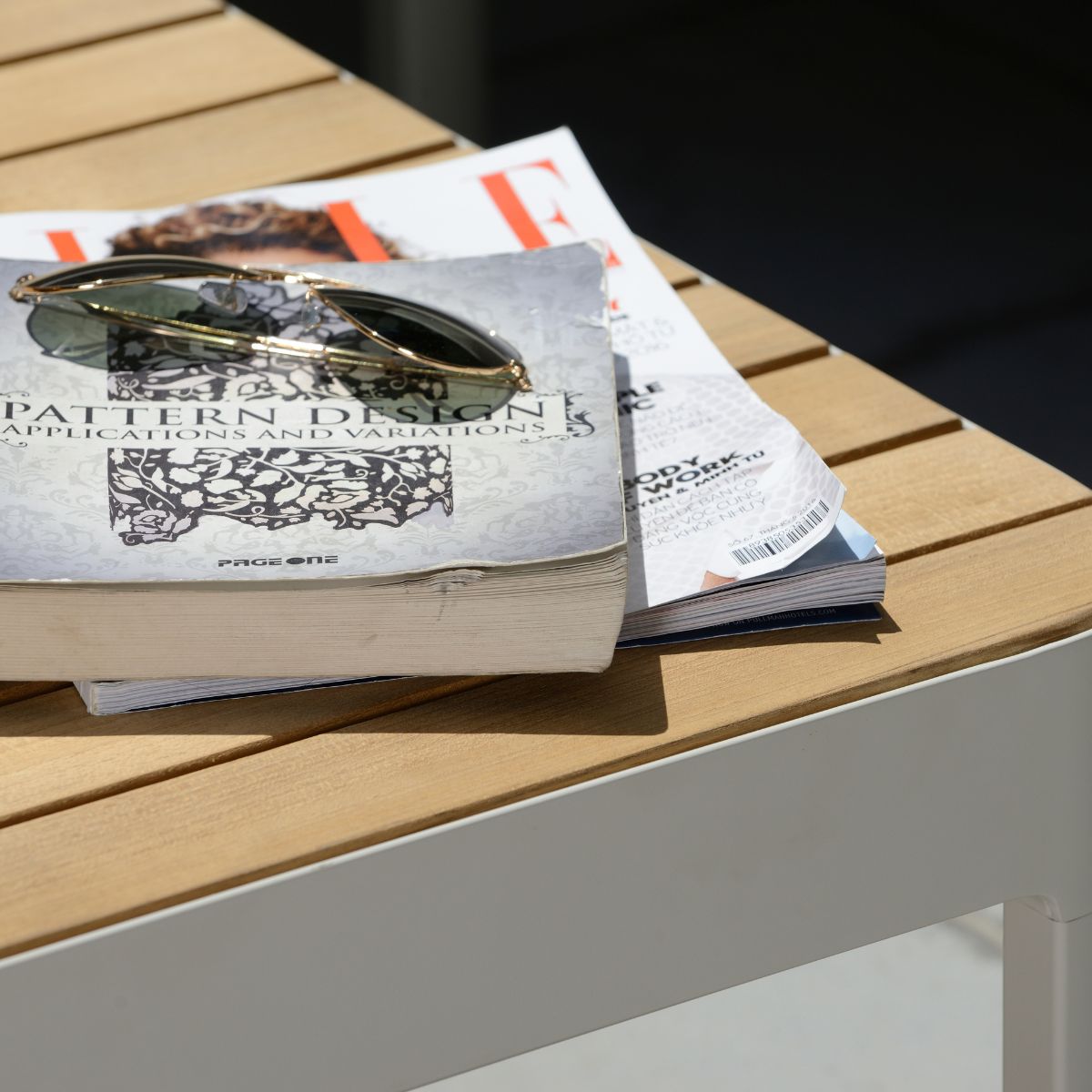 Portals Light C-Shape Set outdoor sofa on table with sunglasses and magazine on Tampa Home & Garden Store