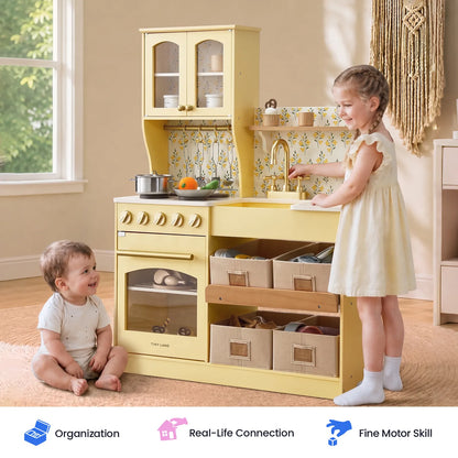 Tiny Land wooden play kitchen with yellow finish, storage drawers and sink; two toddlers playing on Tampa Home & Garden Store