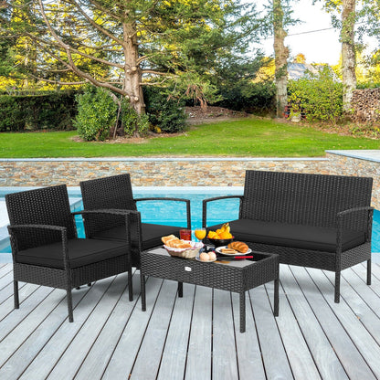 4-piece black rattan outdoor furniture set with cushions and coffee table by pool DirectDeals on Tampa Home & Garden Store