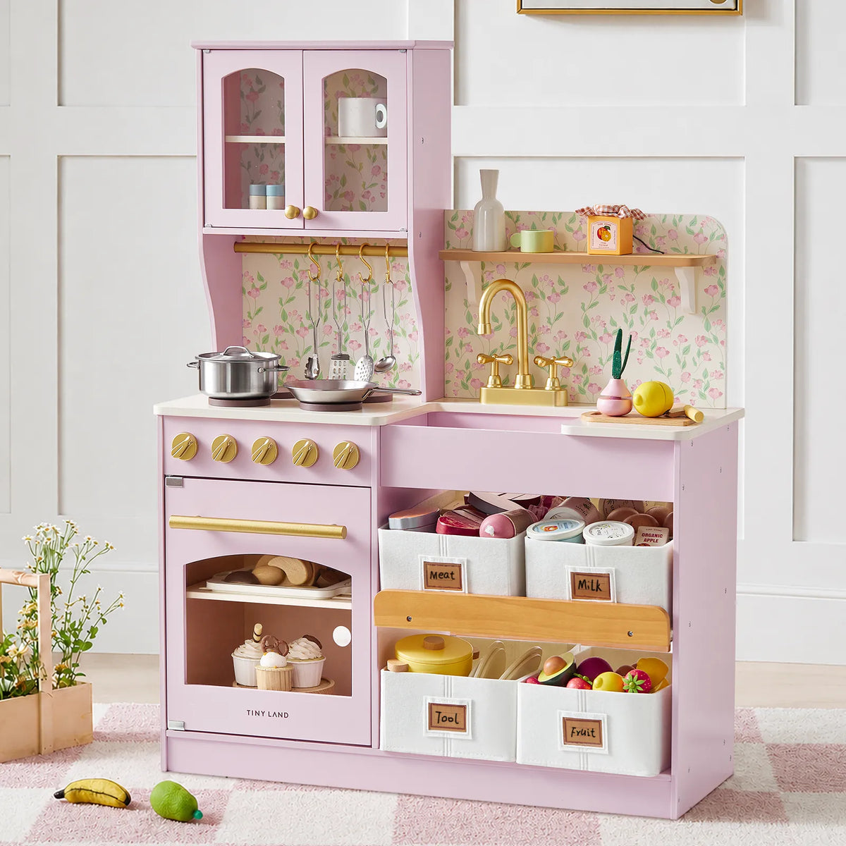 Play kitchen Tiny Land INC in pink with storage cabinets and toy stove on Tampa Home & Garden Store