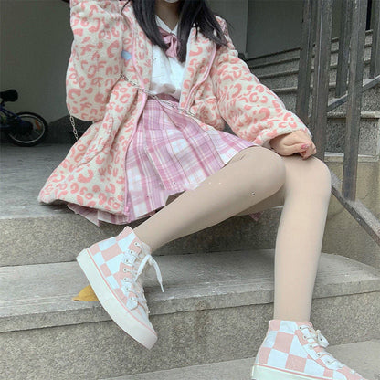 Pink and white checkerboard high-top canvas sneakers by Stevvex, a pair on Tampa Home & Garden Store