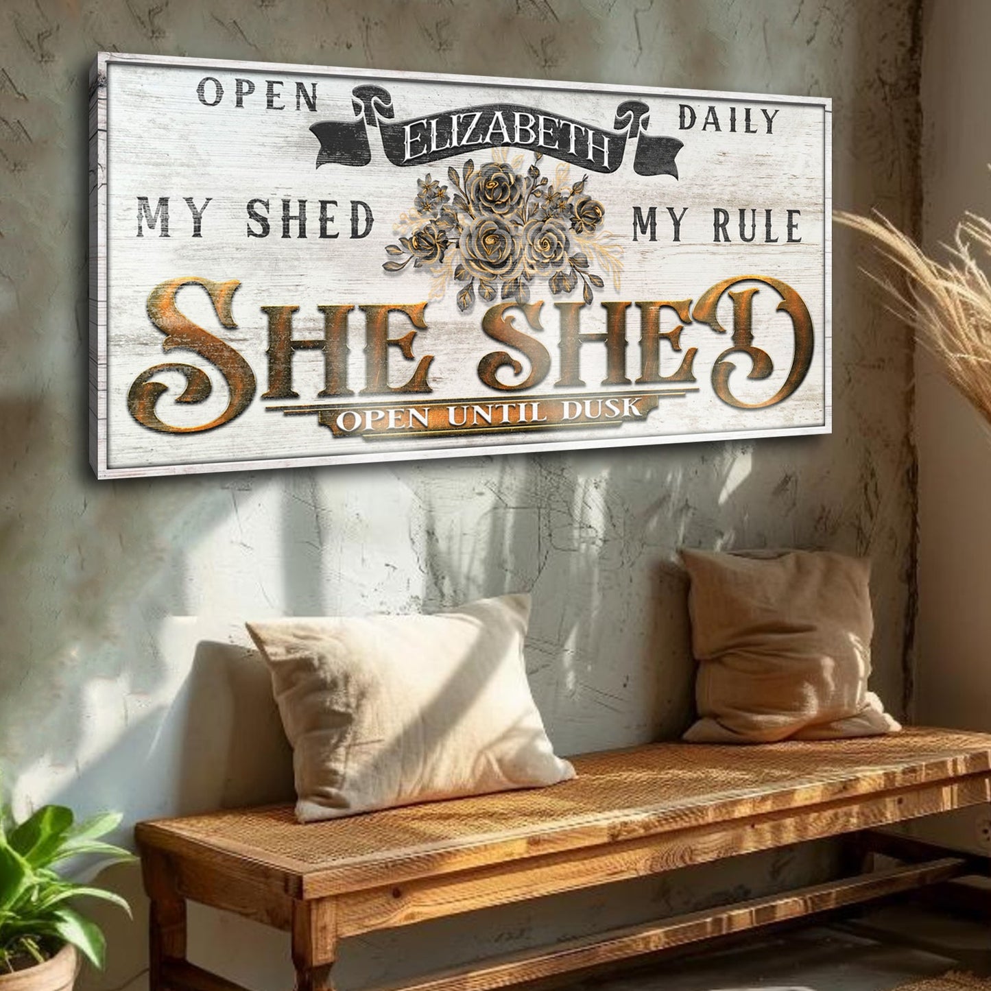 Canvas sign SHE SHED with gold lettering and bouquet on whitewash background open until dusk on Tampa Home & Garden Store