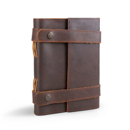 Vintage dark brown leather journal with wrap strap and metal stud closure on Tampa Home & Garden Store