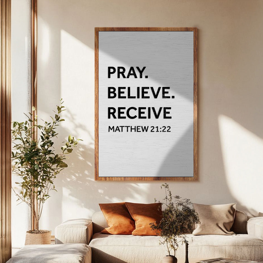 Canvas sign by Tailored Canvases Pray Believe Receive Matthew 21:22 in bold black on light gray wood frame on Tampa Home & Garden Store