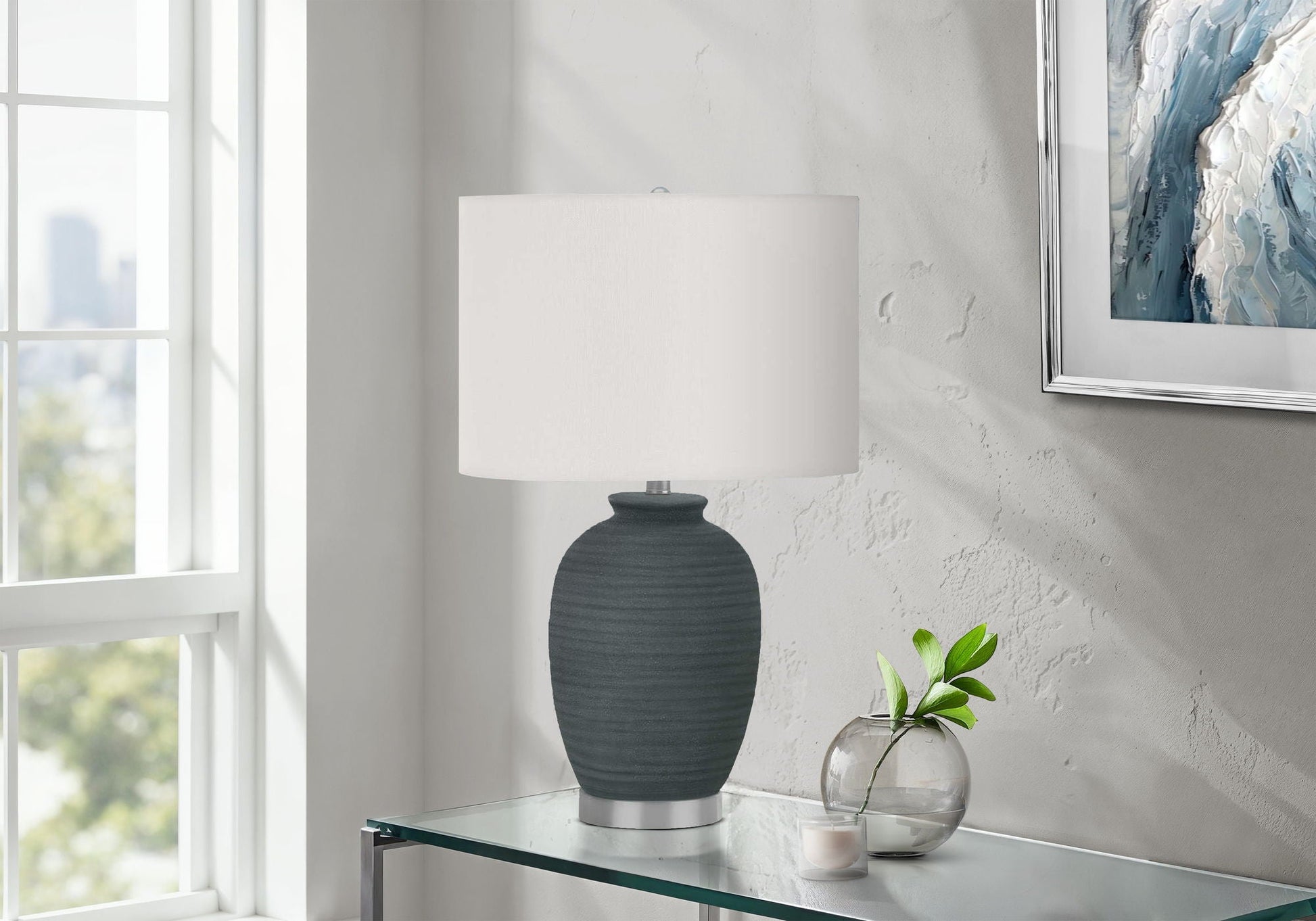 HouseOfZazla blue ceramic table lamp with white fabric shade on glass console on Tampa Home & Garden Store