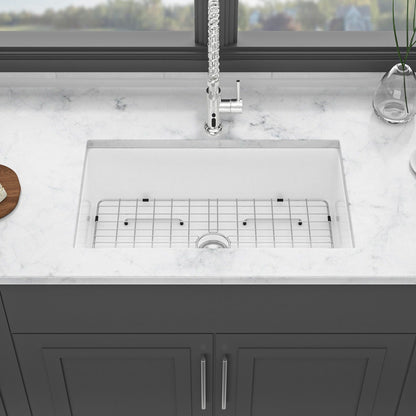 Undermount ceramic farmhouse kitchen sink with wire rack insert and chrome faucet on marble countertop on Tampa Home & Garden Store